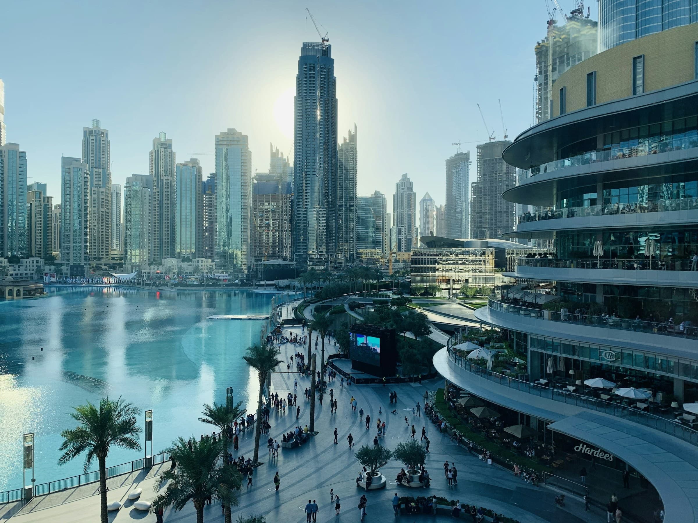 People on a Dubai street between high-rises — the first weeks on the ground