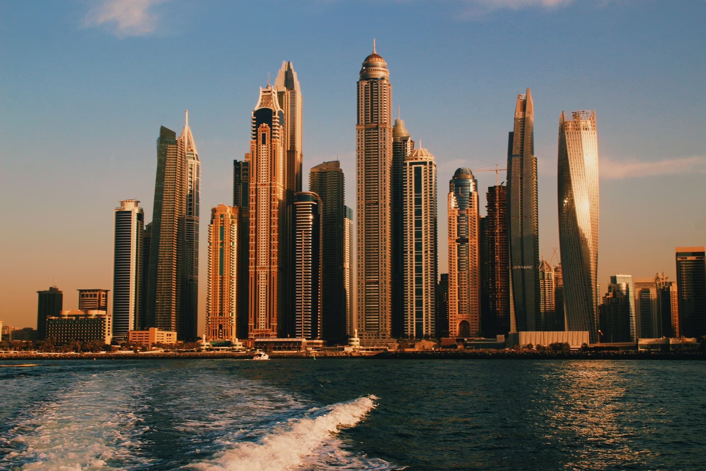 Dubai high-rises from above — the scale of an unassisted move